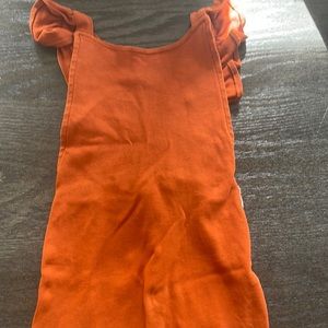 Bamboo baby orange girls romper with ruffle detail